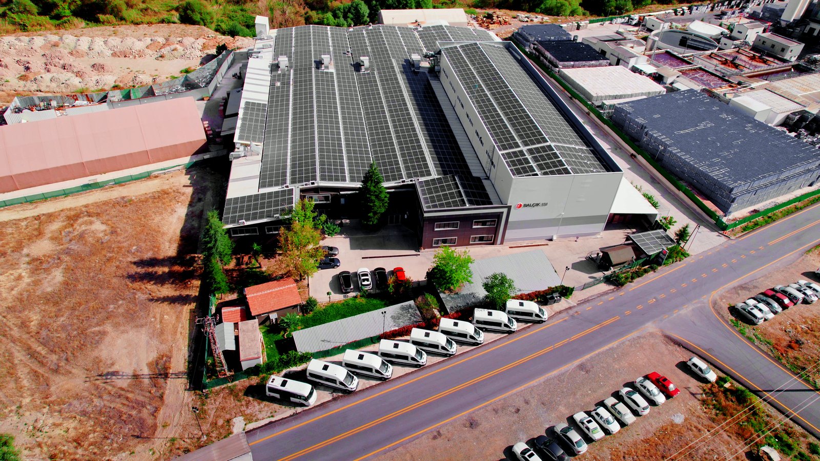 The whole BALÇIK TORMEC plant in Kahramankazan from the air, with solar panels across the roofs