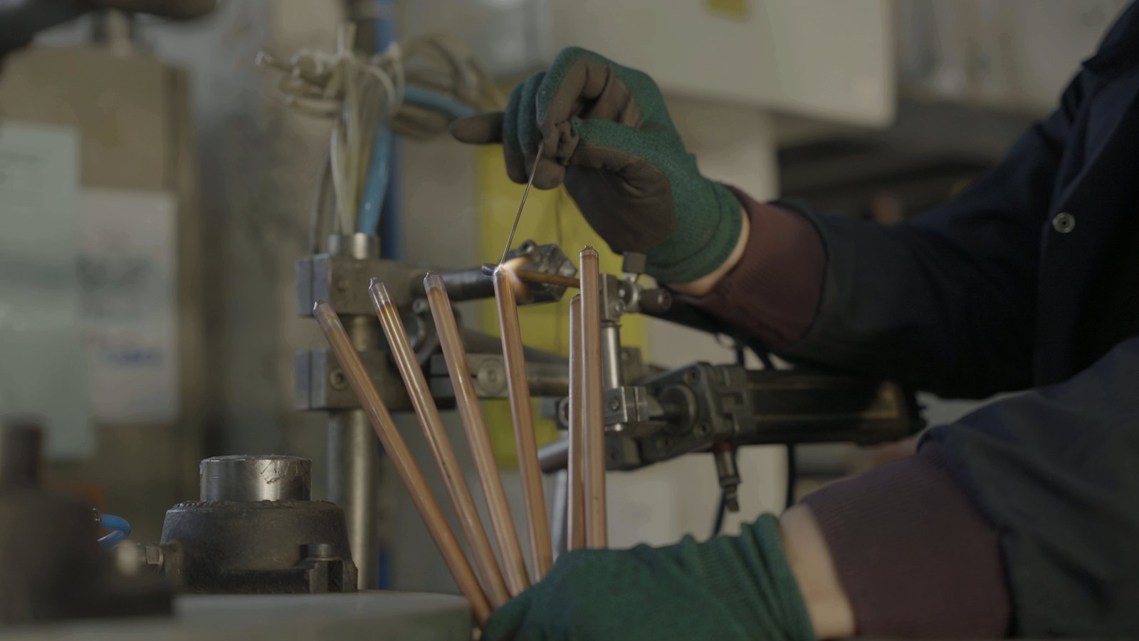 Copper thermostat stems being assembled